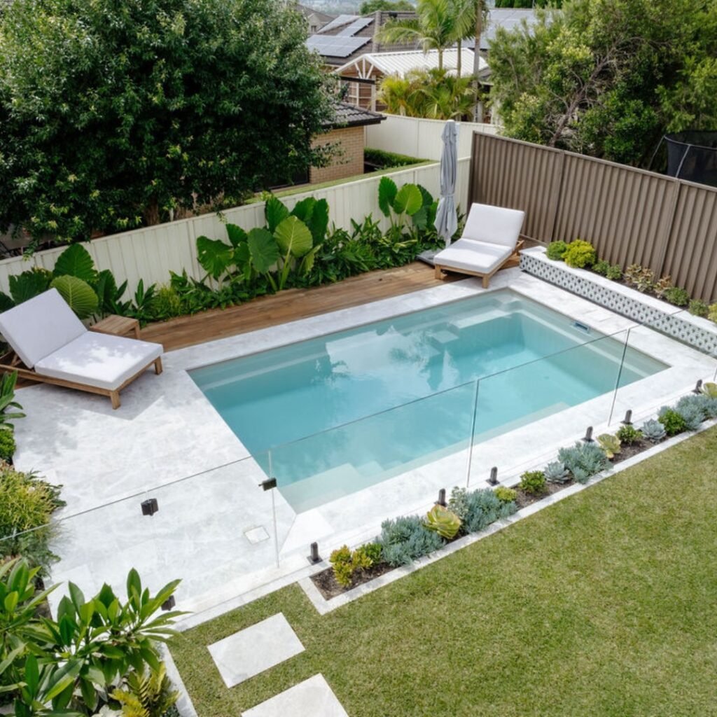 Compact Backyard Pool with Glass Safety Fence